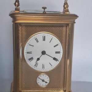 A Fine Quality Honeycomb Dial Striking Carriage Clock