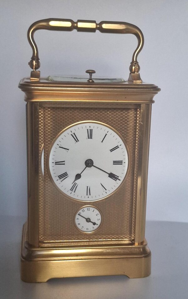 A Fine Quality Honeycomb Dial Striking Carriage Clock